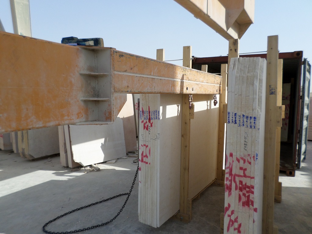 Egyptian marble slabs being loaded by crane into containers for export from Cairo factory